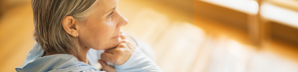 Close-up of a person indoors with warm lighting
